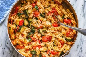 Homemade fresh fusilli pasta recipe served with tomato garlic sauce in a bowl