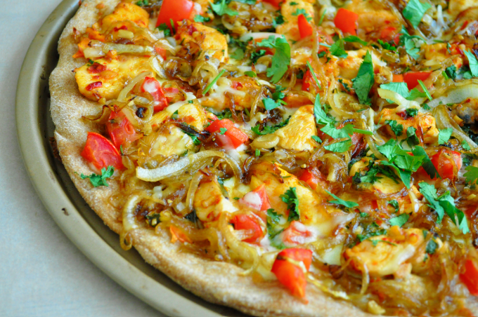 Fresh homemade onion kulcha made with whole wheat flour served with butter and curry