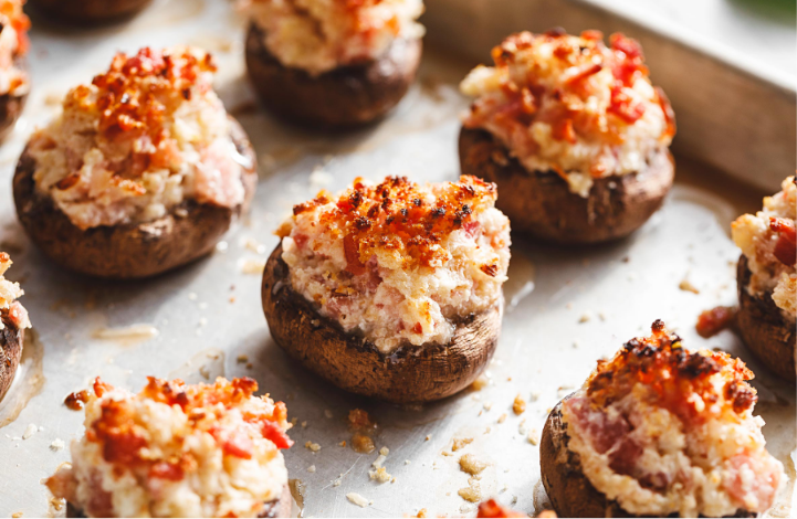 Cream cheese stuffed mushrooms topped with crispy bacon and fresh parsley