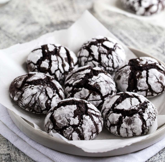 Homemade chocolate crinkle cookies with powdered sugar coating